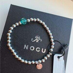 Nogu firefly glowing teal bracelet, new with tags